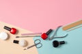 Tools for manicure on a pink background. Nail files, scissors and nail polishes top view. Nail Salon, Beauty Salon