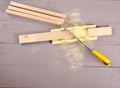 Tools for marking and sawing boards on a workbench. carpentry tool. miter box with a board.