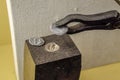 Tools for minting coins. Anvil and vice