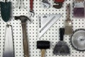 Tools organized on a pegboard in a garage Royalty Free Stock Photo