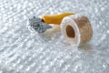 Tools for packing and protecting items during a move, featuring bubble wrap and tape in a bright workspace Royalty Free Stock Photo