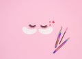 Tools and patches for eyelash extensions and artificial eyelashes on a pink background. Tools for the lashmaker. The view from the