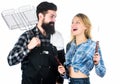 Tools for roasting meat outdoors. Picnic and barbecue. Man bearded hipster and girl ready for barbecue party. Culinary Royalty Free Stock Photo