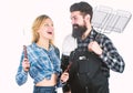 Tools for roasting meat outdoors. Picnic and barbecue. Man bearded hipster and girl ready for barbecue party. Culinary Royalty Free Stock Photo