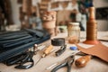 Tools sitting on a bench in a leather workshop