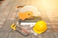 The tools supplies, cutting tool, chisel and helmet put on brick Royalty Free Stock Photo