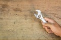 Tools supplies on a wooden background,wrench