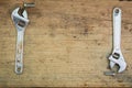 Tools supplies on a wooden background,wrench