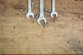 Tools supplies on a wooden background,wrench