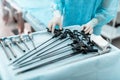 Doctor in sterile gloves taking laparoscopic instrument Royalty Free Stock Photo