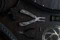 Tools on the table. flat lay. brake disc, multitool, pliers, flashlight, brake tool for a bicycle Royalty Free Stock Photo