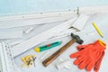 Tools to instal plastic skirting board on laminate flooring. Renovation of baseboard at home.