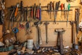 The tools on the wall and table to keep hammers, wrenches, ring spanners, hammer, pliers, screwdrivers, monkey wrenches, screws Royalty Free Stock Photo