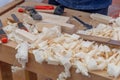 Tools and wood shavings on a carpenter's workbench. Carpentry work on wood