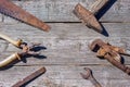 Are the tools on wooden background hammer pliers and open-end wrench Royalty Free Stock Photo