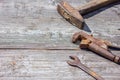 Are the tools on wooden background hammer pliers and open-end wrench Royalty Free Stock Photo