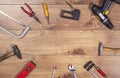 Tools on wooden table top view. Handicraft , engineering and handyman kit on wooden background seen from abowe. Copy space frame o Royalty Free Stock Photo