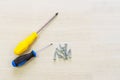 Tools worker, screwdriver, nail, on a white background, top view