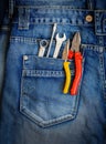 Tools on a workers pocket.