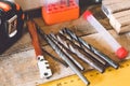 Tools for working with a wrench, a screwdriver and a drill are lying on the table. Various carpentry tools Royalty Free Stock Photo