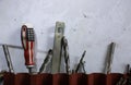 Tools in the workshop drills, screwdrivers, scissors on the metal Royalty Free Stock Photo