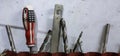 Tools in the workshop drills, screwdrivers, scissors on the metal Royalty Free Stock Photo