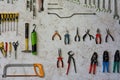 Toolwall with hacksaw and other tools Royalty Free Stock Photo