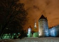 Toompea castle walls and towers highlighted by street lamps in t