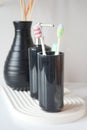 Tooth brushes in glass on table Royalty Free Stock Photo