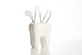 Tooth model with metal medical dentistry equipment tools Royalty Free Stock Photo