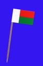 Madagaskar flag ,with Tooth pick wit a small paper flag of Mauritania on a blue screen for chromakey screen for chromakey
