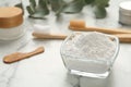 Tooth powder and brushes on white marble table, closeup Royalty Free Stock Photo
