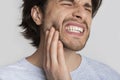 Toothache concept. Man is grimaces from pain Royalty Free Stock Photo