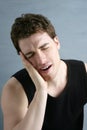 Toothache headache pain gesture young man Royalty Free Stock Photo