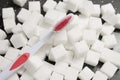 Toothbrush on the background of the sugar cubes of refined sugar, preventing tooth decay, caring for the health of your teeth Royalty Free Stock Photo