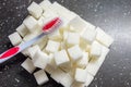 toothbrush on the background of the sugar cubes of refined sugar, preventing tooth decay, caring for the health of your teeth Royalty Free Stock Photo