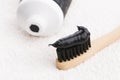 Toothbrush with black charcoal toothpaste Royalty Free Stock Photo
