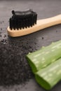 Toothbrush with black charcoal toothpaste with aloe vera Royalty Free Stock Photo