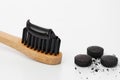 Toothbrush with black charcoal toothpaste