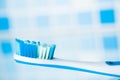 Toothbrush on blue tile background Royalty Free Stock Photo