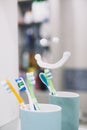 toothbrush cup with smile mirror. High quality photo Royalty Free Stock Photo