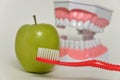 Toothbrush and green apple, dental care concept