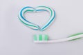 Toothbrush and heart made from a toothpaste. Royalty Free Stock Photo