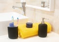 Toothbrush holder ,towel,cream and liquid soap dispenser . Royalty Free Stock Photo