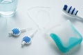 Toothbrush, mouthwash, floss and blue interdental brushes as equipment for daily dental care, prevention and hygiene Royalty Free Stock Photo