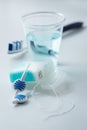 Toothbrush, mouthwash, floss and blue interdental brushes as equipment for daily dental care, prevention and hygiene Royalty Free Stock Photo