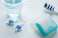 Toothbrush, mouthwash, floss and blue interdental brushes as equipment for daily dental care, prevention and hygiene Royalty Free Stock Photo