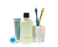 Toothbrush, mouthwash, floss, tongue cleaner and toothpaste isolated on white background.