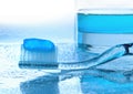 Toothbrush and mouthwash on wet glass Royalty Free Stock Photo