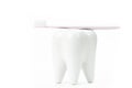 Toothbrush stand shaped like primary molar tooth with toothbrush